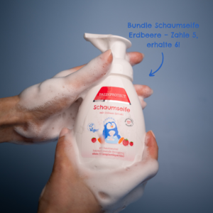 a person holding a bottle of soap