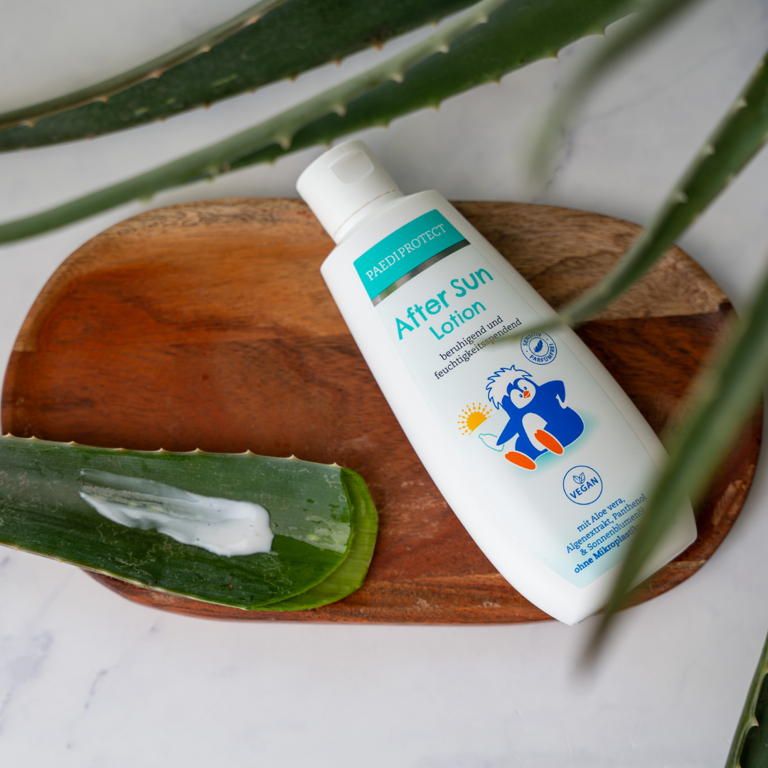 PAEDIPROTECT After un Lotion auf Holzplatte mit Aloe Vera 